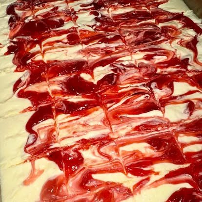 A full pan of strawberry cheesecake dessert bars
