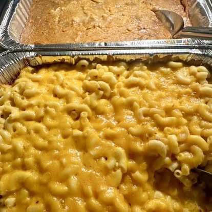 Catering pans of mac and cheese and cornbread