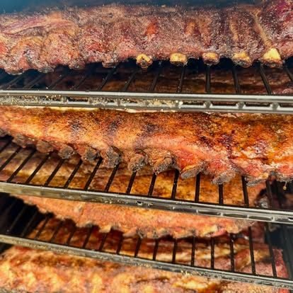 Racks of ribs smoking low and slow
